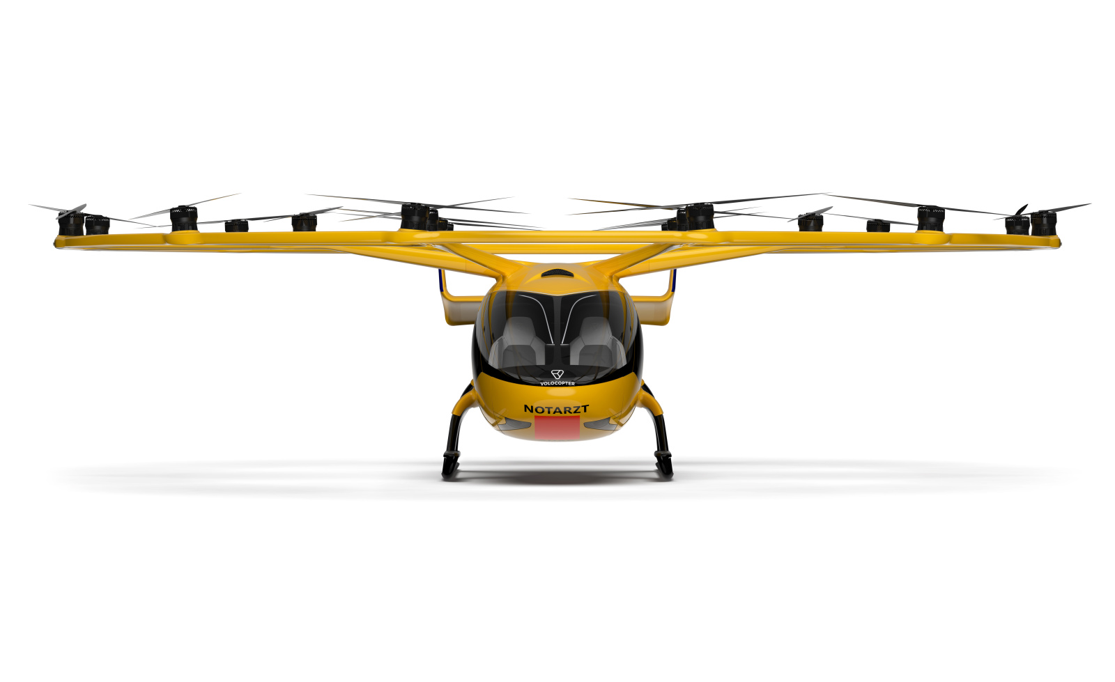 Frontansicht eines gelben Rettungshubschraubers mit NOTARZT-Beschriftung und mehreren Rotoren für Luftrettungseinsätze.